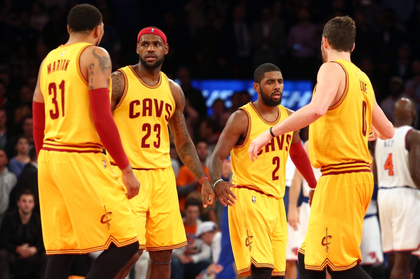 Dec 4, 2014; New York, NY, USA; Cleveland Cavaliers small forward Shawn Marion (31) and small forward LeBron James (23) and point guard Kyrie Irving (2) and power forward Kevin Love (0) react after Irving's late basket to put the Cavaliers up by 3 against the New York Knicks during the fourth quarter at Madison Square Garden. The Cavaliers defeated the Knicks 90-87. Mandatory Credit: Brad Penner-USA TODAY Sports